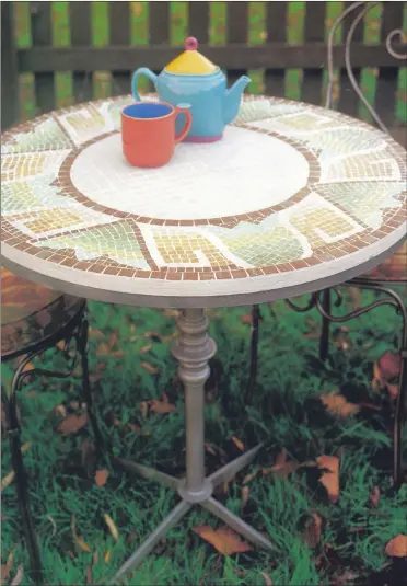  ??  ?? Build a mosaic table top using your own design and colourful glass tiles.