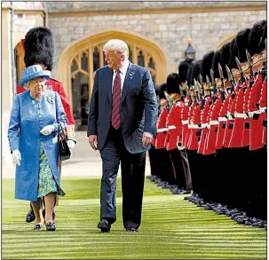  ?? AP/PABLO MARTINEZ MONSIVAIS ?? President Donald Trump and Queen Elizabeth II inspect the troops on Friday at Windsor Castle. Trump’s audience with the queen closed out his two-day visit to England.