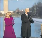 ?? GABER/USA TODAY] ?? Joe Biden and his wife, Jill, attend a memorial Tuesday for lives lost to COVID19 around the Lincoln Memorial Reflecting Pool. [HANNAH