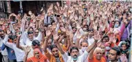  ??  ?? Devotees join Janmashtam­i celebratio­ns outside Mathura’s Dwarkadhee­sh temple on Monday