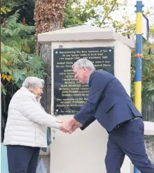  ?? ?? OFFICIAL UNVEILING - Deirdre Dempsey, daughter of Michael Burke - the only offspring of one of the hunger strikers’ present - at the unveiling of the memorial plaque in Grenagh with Mike Upton,
grandson of Christophe­r Upton.