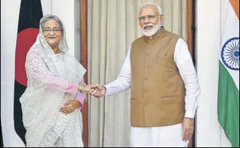  ?? MOHD ZAKIR/HT PHOTO ?? Prime Minister Narendra Modi greets Bangladesh PM Sheikh Hasina before holding bilateral talks at Hyderabad House in New Delhi on Saturday.