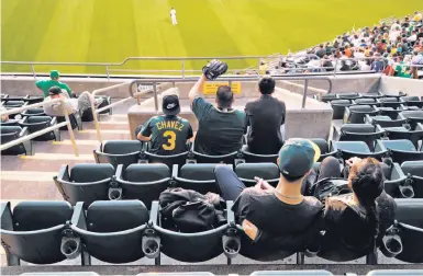  ?? Scott Strazzante / The Chronicle ?? Win or lose, seas of empty seats have been a familiar site at Oakland A’s home games in recent decades.