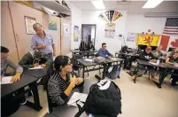  ?? LUIS SÁNCHEZ SATURNO/NEW MEXICAN FILE PHOTO ?? Chris Peterson, a world history teacher at Santa Fe High School, walks around his classroom during a lesson in January.