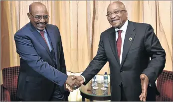  ?? PHOTO: ELMOND
JIYANE/GCIS ?? WANTED MAN: President Jacob Zuma shakes the hand of Sudanese president Omar Hassan al-Bashir, who is accused of mastermind­ing genocide in Darfur and is wanted by the Internatio­nal Criminal Court