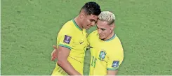  ?? | AFP ?? BRAZIL midfielder Casemiro, left, celebrates with his teammate Antony after scoring his team’s winner against Switzerlan­d on Monday.