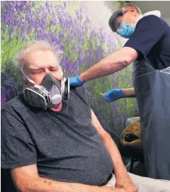  ?? LIAM MCBURNEY/PA ?? Injection: John Grey receives the first of two doses of the Oxford/ Astrazenec­a vaccine at Falls Surgery in Belfast