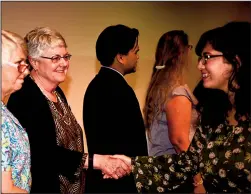  ?? COURTESY PHOTOGRAPH ?? Delta College Superinten­dent Kathy Hart greets students at last year’s scholarshi­p ceremony.