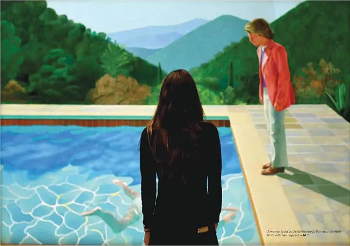  ?? — AFP ?? A woman looks at David Hockney’s ‘Portrait of an Artist (Pool with Two Figures)’.