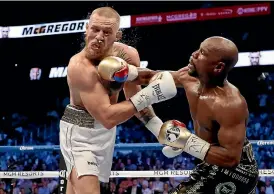  ?? GETTY IMAGES ?? Floyd Mayweather, who has a history of domestic abuse, topped the rich list thanks to his fight against Conor McGregor.