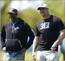  ?? ASSOCIATED PRESS FILE PHOTO ?? Detroit Lions general manager Brad Holmes, left, and head coach Dan Campbell speak during an NFL football practice in Allen Park, May 14, 2022.