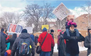  ?? MEGAN BENNETT/JOURNAL ?? The second annual Women’s March in Santa Fe moves along Old Santa Fe Trail on Jan. 21, 2018.