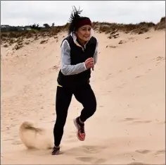  ??  ?? A tough slog in the sand on Ballineske­r beach for Phil Healy.