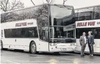  ??  ?? ●●Belle Vue Manchester managing director Phil Hitchen, right, with transport director Ian Bragg and one of the new double-decker coaches