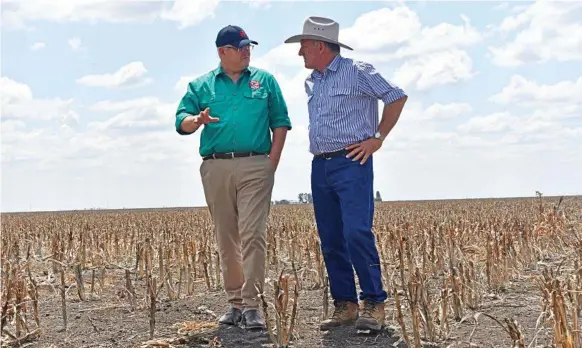  ?? Photo: Meg Gannon ?? PM IN TOWN: Prime Minister Scott Morrison (left) visits Dalby farmer David Gooding’s property yesterday, where he announced more drought funds.