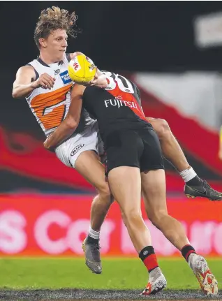  ?? Picture: MICHAEL KLEIN ?? UNDER PRESSURE: Lachie Whitfield of the Giants tackled by Brandon Zerk-Thatcher of the Bombers during Friday night’s match