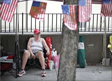  ?? (Mike Simons/Tulsa World via AP) ?? Rose Brown and other Trump supporters line up and camp Friday on Fourth Street ahead of President Donald Trump’s campaign rally today. in downtown Tulsa, Okla.,