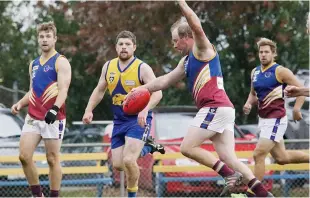  ??  ?? Warragul Industrial­s player Tye Holland boots the ball into attack.