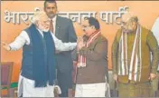  ??  ?? Prime Minister Narendra Modi and home minister Amit Shah with ■ new BJP president JP Nadda in New Delhi on Monday.