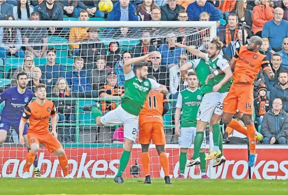  ??  ?? Defender William Edjenguele (right) heads his side level the last time Dundee United travelled to Easter Road to play Hibs.