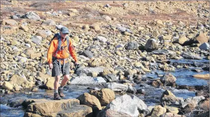  ?? SUBMITTED PHOTO ?? Bob Hicks, seen here hiking in The Tablelands, gave up his high-tech teaching job in the 1990s to pursue Gros Morne Adventures.