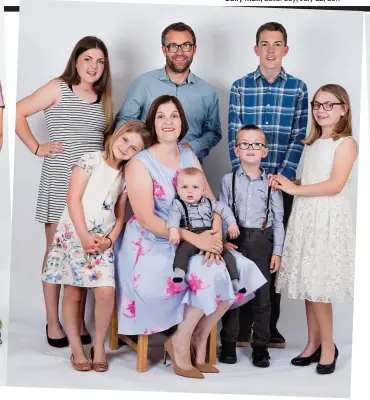  ??  ?? ‘The children are each other’s best friends’: Rebecca and Shaun Hurr with (from left) Poppy, Neve, Milo, Felix, Jacob and Gracie