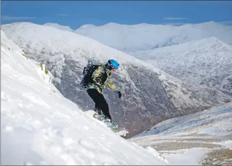  ?? ?? A snowboarde­r riding down the Wall piste at Glencoe Mountain Resort.