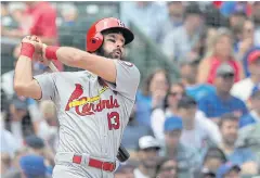  ?? AP ?? The Cardinals’ Matt Carpenter watches his home run off the Cubs’ Tyler Chatwood.