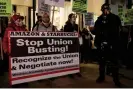  ?? Photograph: Yuki Iwamura/ AFP/Getty Images ?? People rally in support of Amazon and Starbucks workers in New York City on 26 November 2021.