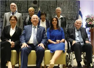  ?? (Mark Neyman/GPO) ?? INCOMING SUPREME COURT President Esther Hayut (lower-left) poses yesterday with President Reuven Rivlin and several other officials following a farewell ceremony for outgoing Supreme Court President Miriam Naor in Tel Aviv.