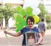  ?? Staff photo by Sara Vaughn ?? ■ Jennifer Houser continues the annual tradition of rememberin­g her daughter, Morgan Angerbauer, who died July 1, 2016, in the jail at Bi-State Justice Building.