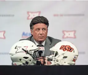  ?? LM OTERO/AP ?? Oklahoma State head coach Mike Gundy listens to a question during the Big 12 football media days July 15 in Arlington, Texas.