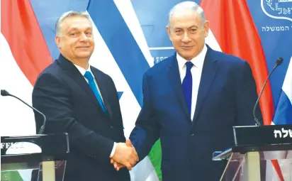  ?? (Debbie Hill/Reuters) ?? HUNGARIAN PRIME MINISTER Viktor Orban shakes hands with Netanyahu in Jerusalem in 2018.