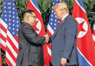  ?? AP PHOTO ?? U.S. President Donald Trump shakes hands with North Korea leader Kim Jong Un at the Capella resort on Sentosa Island Tuesday, in Singapore.