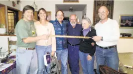  ?? Courtesy of Dave Covill ?? About 40 people have completed all 64 county high points in Colorado. When they do, it’s customary to sign an antique wooden Swiss ice axe.