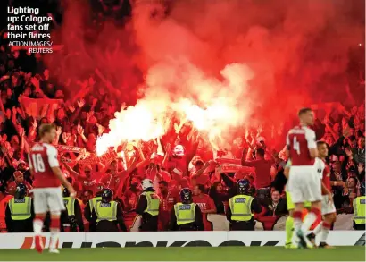  ?? ACTION IMAGES/ REUTERS ?? Lighting up: Cologne fans set off their flares