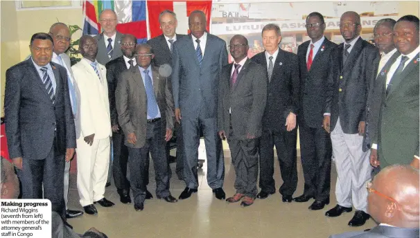  ??  ?? Making progress Richard Wiggins ( seventh from left) with members of the attorney general’s staff in Congo