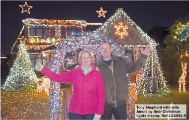  ?? ?? Tony Shepherd with wife Jancis by their Christmas lights display. Ref:134081-9