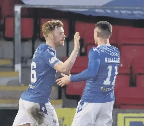  ??  ?? 0 Liam Craig, left, celebrates after scoring from the penalty spot in the dying seconds to earn a point for St Johnstone