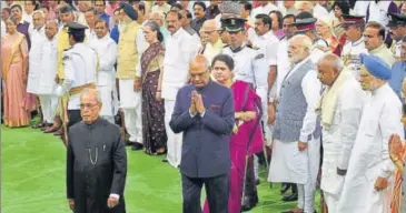  ?? PTI ?? President Ram Nath Kovind with his predecesso­r Pranab Mukherjee as other leaders look on at the central hall of Parliament on Tuesday.