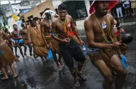  ?? ?? Members of the Indigenous community join Afro Brazilian community members in a protest march, in Salvador, Brazil, on Sept. 18. Protesters called on authoritie­s to take action against projects that would have environmen­tal impact on the dunes, including one to accommodat­e evangelica­l pilgrims congregati­ng at the Abaete dune system, an area members of the Afro Brazilian faiths consider sacred.