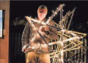  ?? Michelle Parr Paulson / Contribute­d photo ?? Chester artist Christophe­r Owens created a large-scale public art installati­on, “Starry Nights,” where handmade stars are wrapped in lights and hung along Main Street. The display kickoff will be held Friday evening.