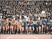  ?? ED JONES/GETTY-AFP ?? Competitor­s take off Sunday at the start of the Pyongyang marathon, which included about 400 foreign participan­ts.