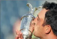  ?? JON SUPER — THE ASSOCIATED PRESS ?? Francesco Molinari of Italy kisses the Claret Jug after winning the British Open Golf Championsh­ip in Carnoustie, Scotland, Sunday.