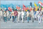  ??  ?? Protesters block the KMP Expressway during a roadblockp­rotest to mark the 100 days of protests against the new farm laws, at Kundli in Haryana on Saturday.