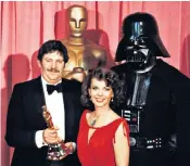  ??  ?? Mollo collecting his Oscar for Star Wars, with Natalie Wood and Darth Vader; (right) Mark Hamill as Luke Skywalker, Carrie Fisher as Princess Leia and Harrison Ford as Han Solo in the original film of 1977