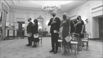  ?? ASSOCIATED PRESS ?? IN THIS JAN. 21, 2021, FILE PHOTO, DOUG EMHOFF (LEFT), Vice President Kamala Harris, President Joe Biden, and first lady Jill Biden, stand during a performanc­e of the national anthem during a virtual Presidenti­al Inaugural Prayer Service, in the State Dinning Room of the White House in Washington. Biden on Thursday addressed the National Prayer Breakfast, a Washington tradition that calls on political combatants to set aside their difference­s for one morning.