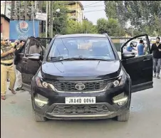  ?? WASEEM ANDRABI/HT PHOTO ?? Police inspect the damaged car of journalist Shujaat Bukhari, who was shot dead by unidentifi­ed gunmen outside his office at Press Colony in Srinagar on Thursday.