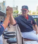  ?? BRANDON ?? Memphis Redbirds manager Stubby Clapp greets players before a game Aug. 7 at AutoZone Park. DILL / FOR THE COMMERCIAL APPEAL