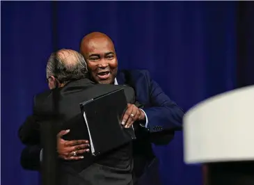  ?? Marie D. De Jesús/Staff file photo ?? Democratic National Committee chair Jaime Harrison and Texas Democratic Party chairman Gilberto Hinojosa greet each other during the 2022 Texas Democratic Convention in July in Dallas.